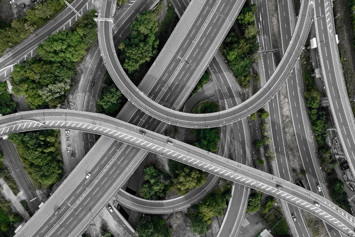 Aerial view of a multi-level motorway interchange.