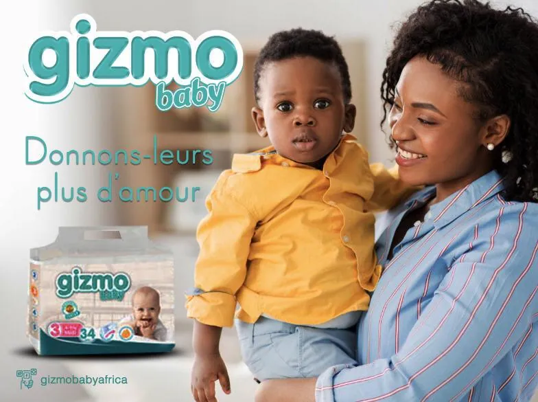 Publicité pour les couches Gizmo Baby : une femme tenant un bébé à côté d'un paquet, avec la mention « Donnons-leur plus d’amour ».