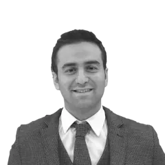 Portrait of a man in a suit and tie.