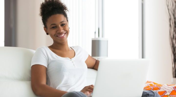 African American student girl using a laptop computer - black people